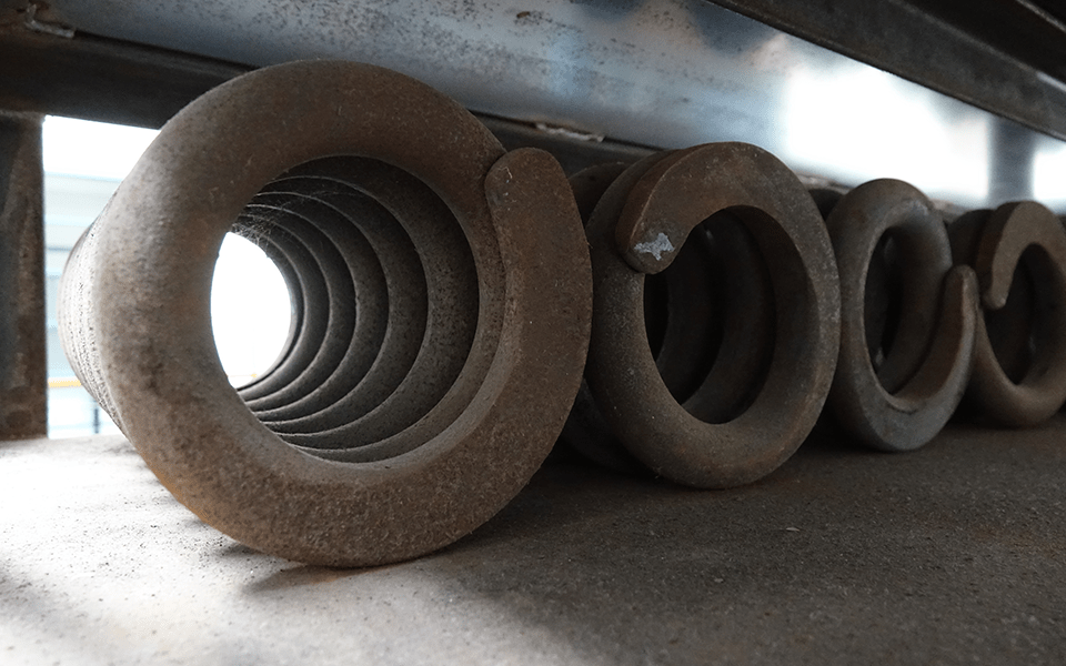 A Coil Spring on the Whitham Spring Coiler machine