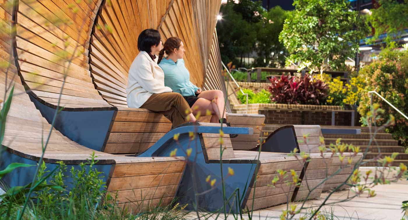 Two ladies relaxing at Interchange Pavilion, a free public art located at South Eveleigh, near Redfern Station